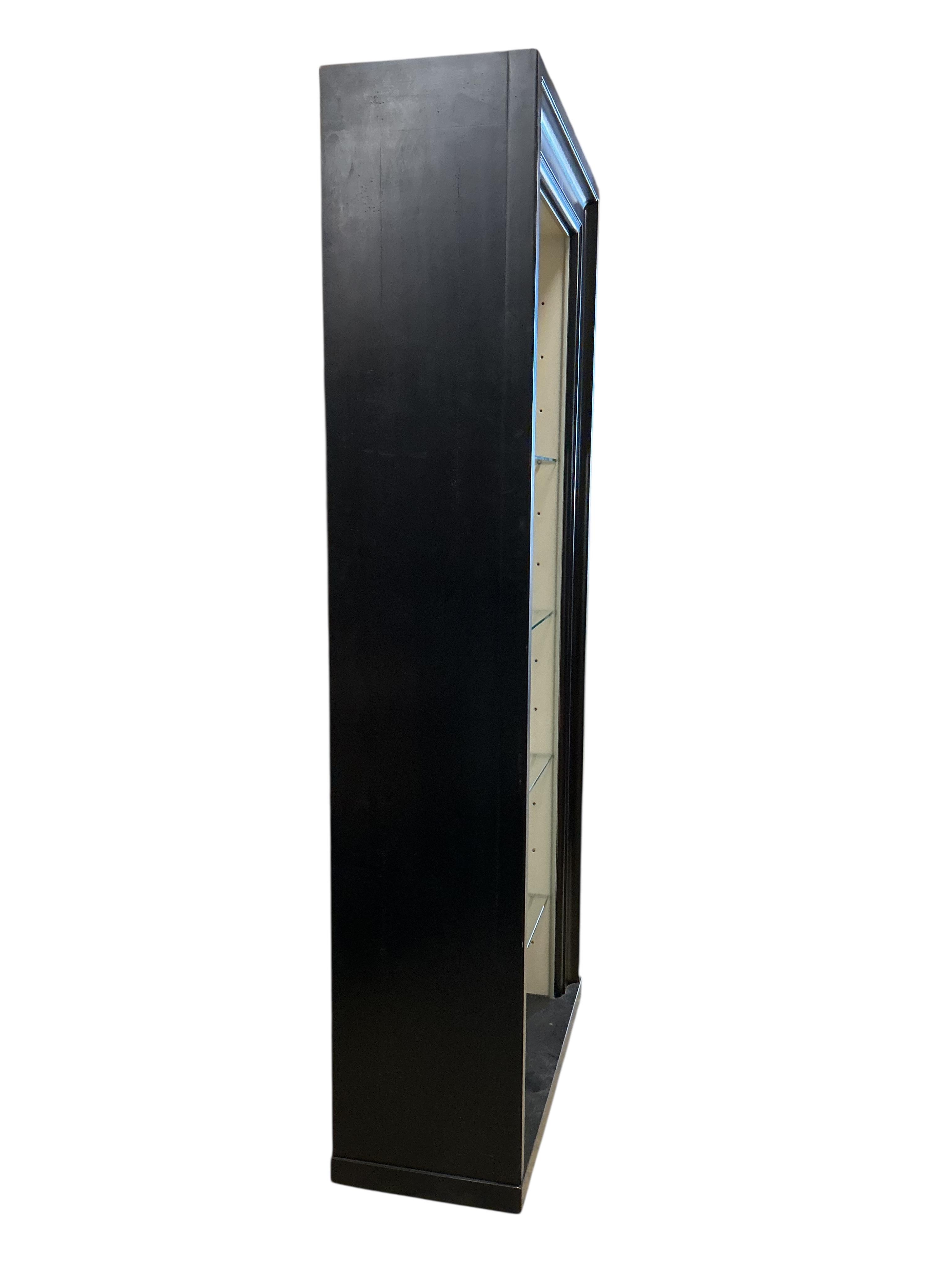 A pair of contemporary ebonised open display units, width 92cm, depth 39cm, height 217cm